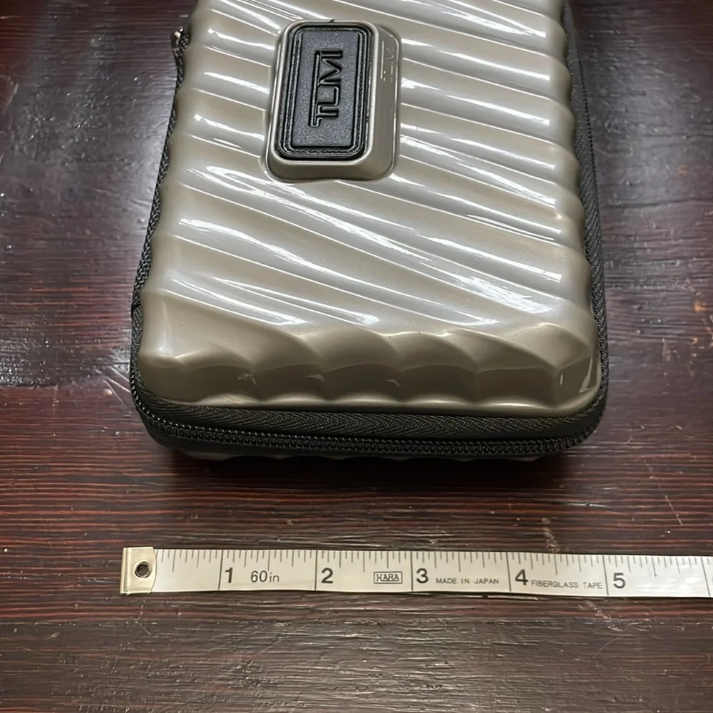 TUMI Silver Travel Size Hard Shell Case With Sturdy Black Zipper & Inner Elastic